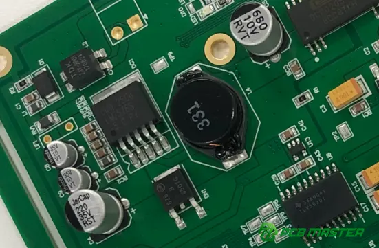 Close-up of a PCB with polarized capacitors showing capacitor placement and polarity markings for electronic circuit assembly.